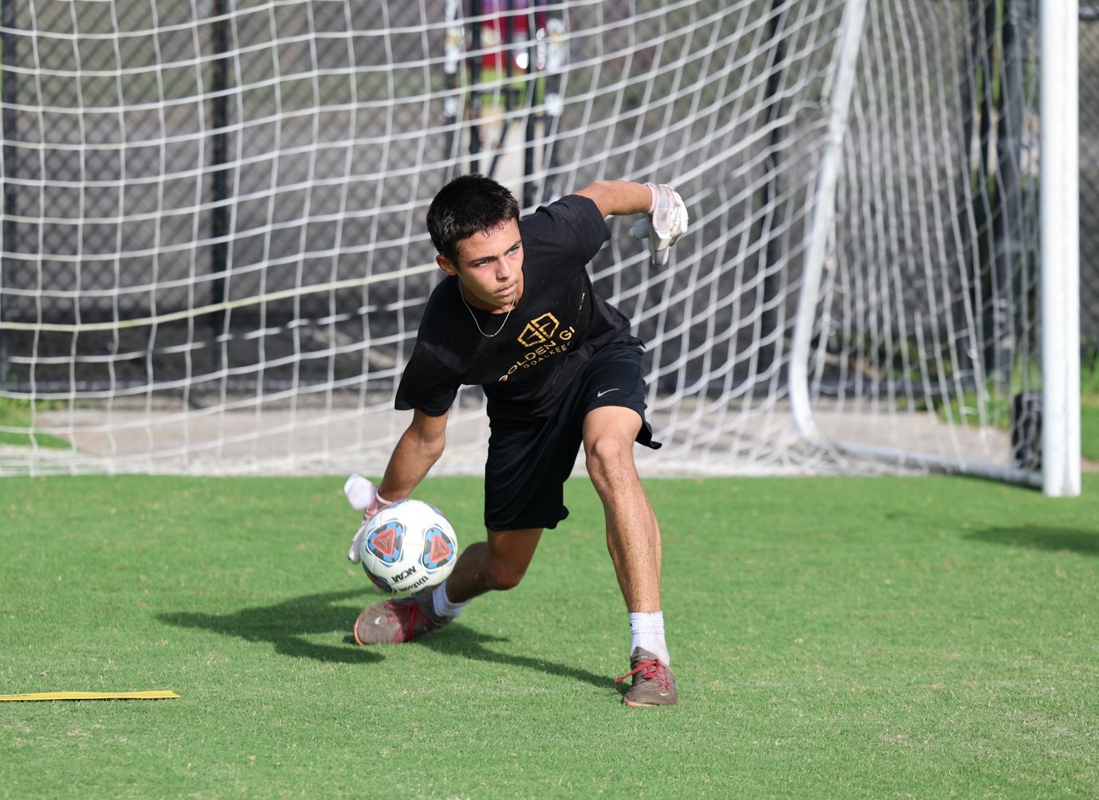 GGK goalkeeper making a low save in training